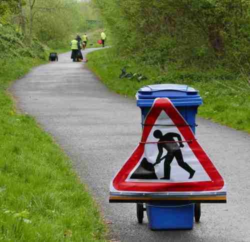 Volunteers at work - sign